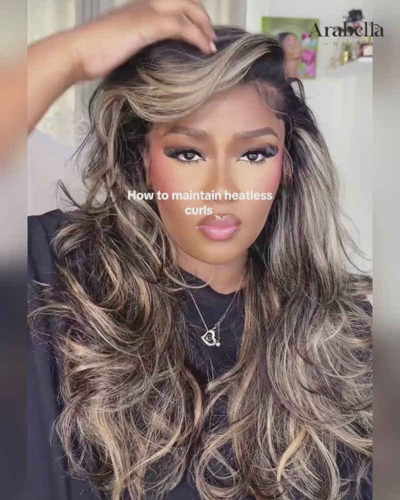 Woman styling Arabella Hair platinum blonde ombre loose body wave human hair wig in tutorial video.